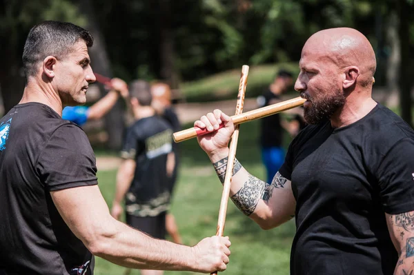 Stock image Students practice filipino escrima stick fighting. Outdoor training