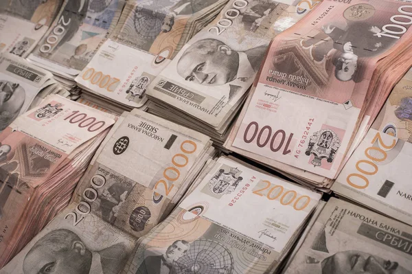 Χρήματα στοιβαγμένα το ένα πάνω στο άλλο σχηματίζοντας ένα υπόβαθρο χρήματα — Φωτογραφία Αρχείου
