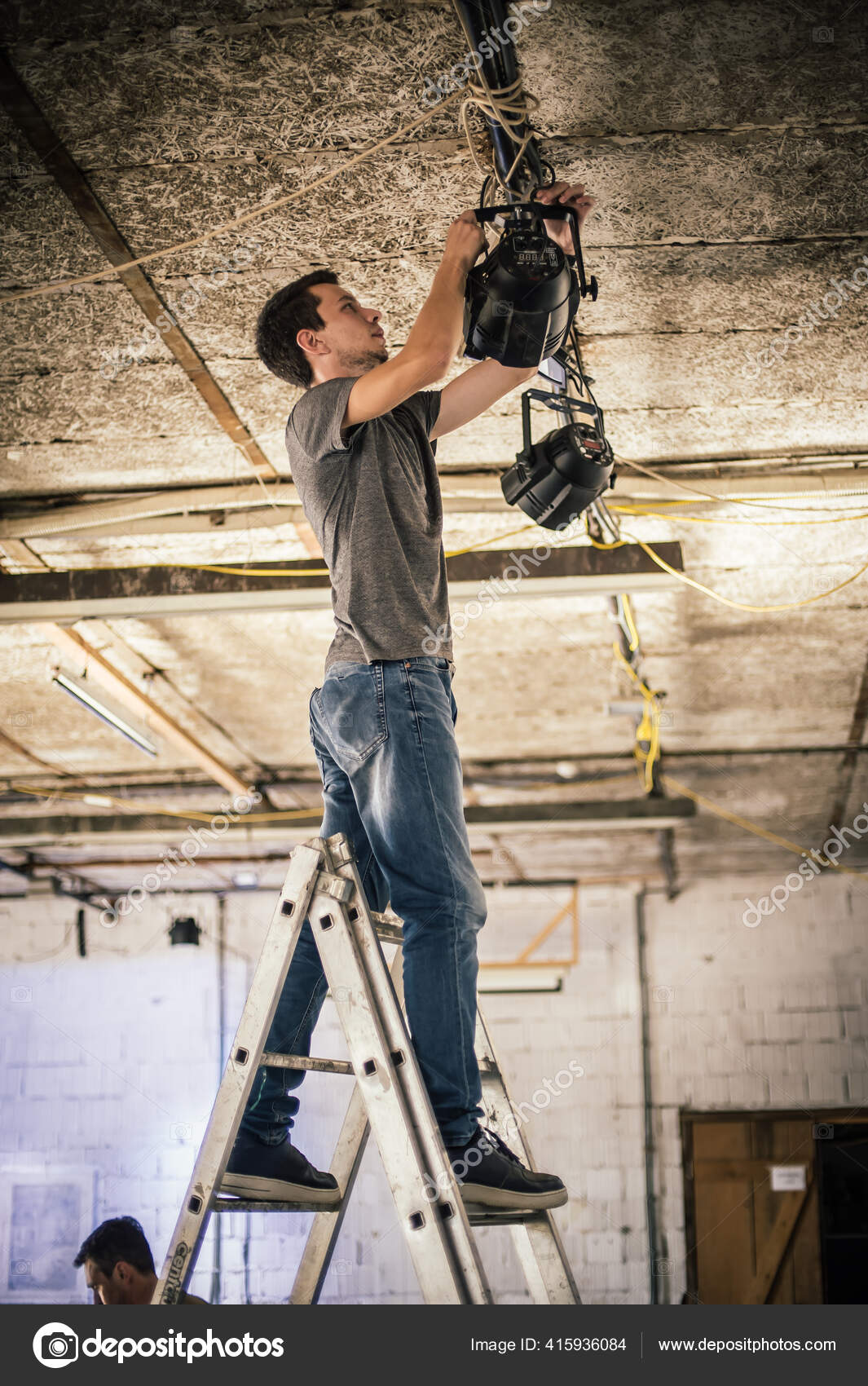 scene-lighting-technician-electric-engineer-adjusting-stage-lights