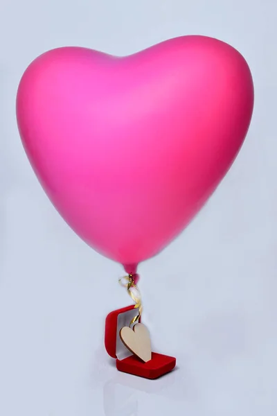 Red heart balloon and box  isolated on a white