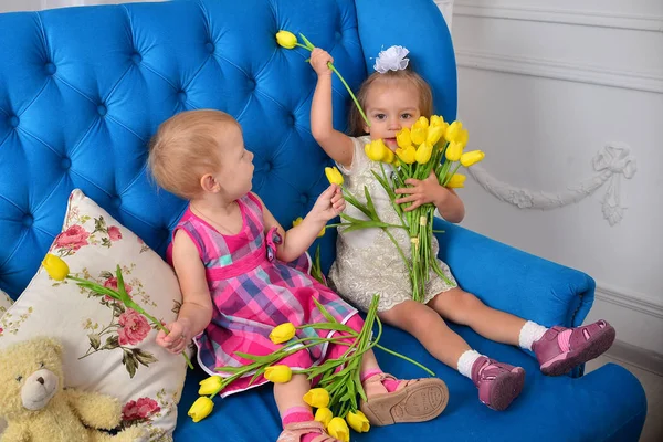 Two Little Girls Playing Tulips — Stock Photo, Image