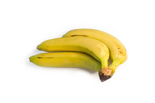 Três bananas em fundo isolado branco — Fotografia de Stock
