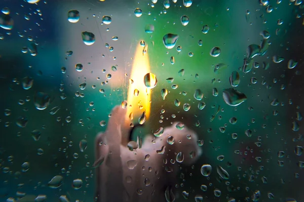 Blurred background on glass and raindrops on it — Stock Photo, Image