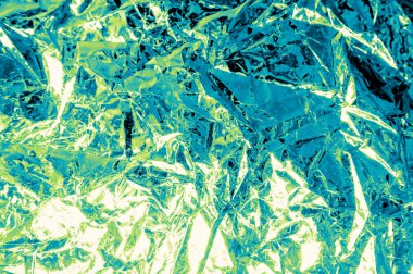 Yeşil ve mavi bir yansıması ile buruşuk folyo Arka plan