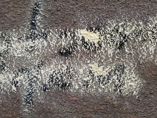 Dark rough surface with spots of paint — Stock Photo, Image