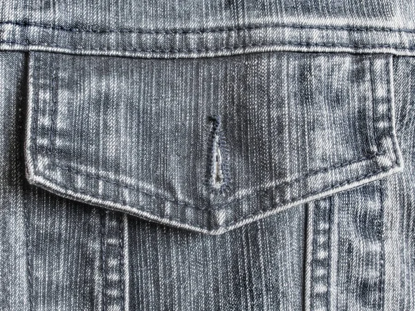 Unbuttoned old rubbed gray jeans pocket — Stock Photo, Image