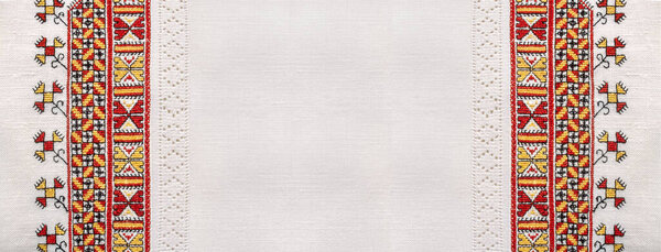 Bright ukrainian national handmade embroidery on white linen