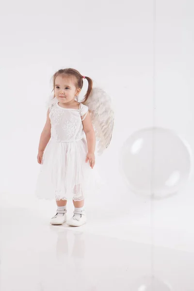 Little Girl White Dress Wings Playing White Background — Stock Photo, Image