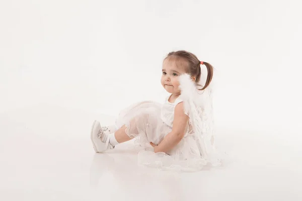 Little Girl White Dress Wings Playing White Background — Stock Photo, Image