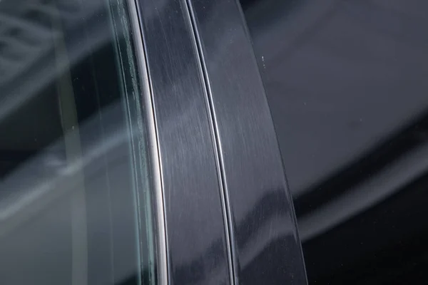 tinted black car Windows that reflect the glass ceiling