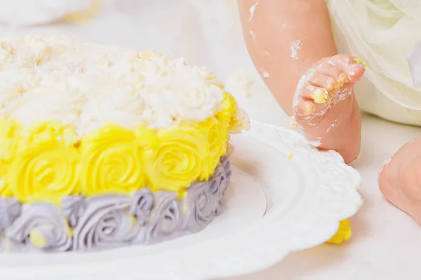 leg of baby food on white background. Feet and cake