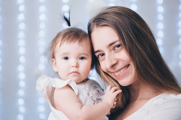 Baby in the arms of the mother. Woman holding a child — Stock Photo, Image