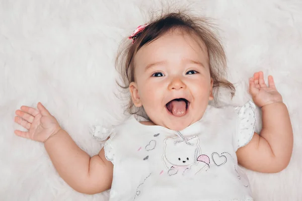 Portrait of a newborn baby with his tongue sticking out — Stock Photo, Image