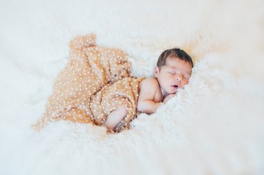 newborn baby sleeps wrapped in a blanket clipart