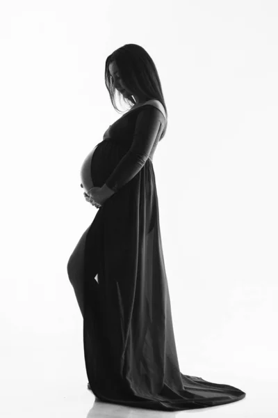 Silhouette di donna incinta su sfondo bianco. Il concetto di uno stile di vita sano, FIV — Foto Stock