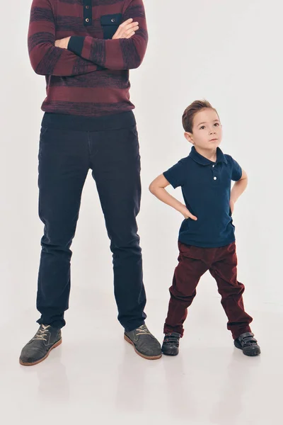 Two men in identical poses. Father and son. Business development concept, demonstration of strength, continuity — Stock Photo, Image