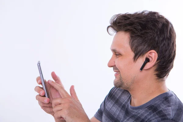 Girl Inserts Wireless Headset Her Ear Starts Talking Phone Using — Stock Photo, Image
