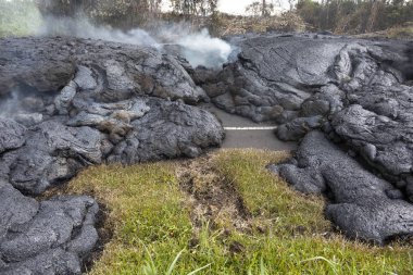 Highway in Hawaii, which was destroyed by a lava flow clipart