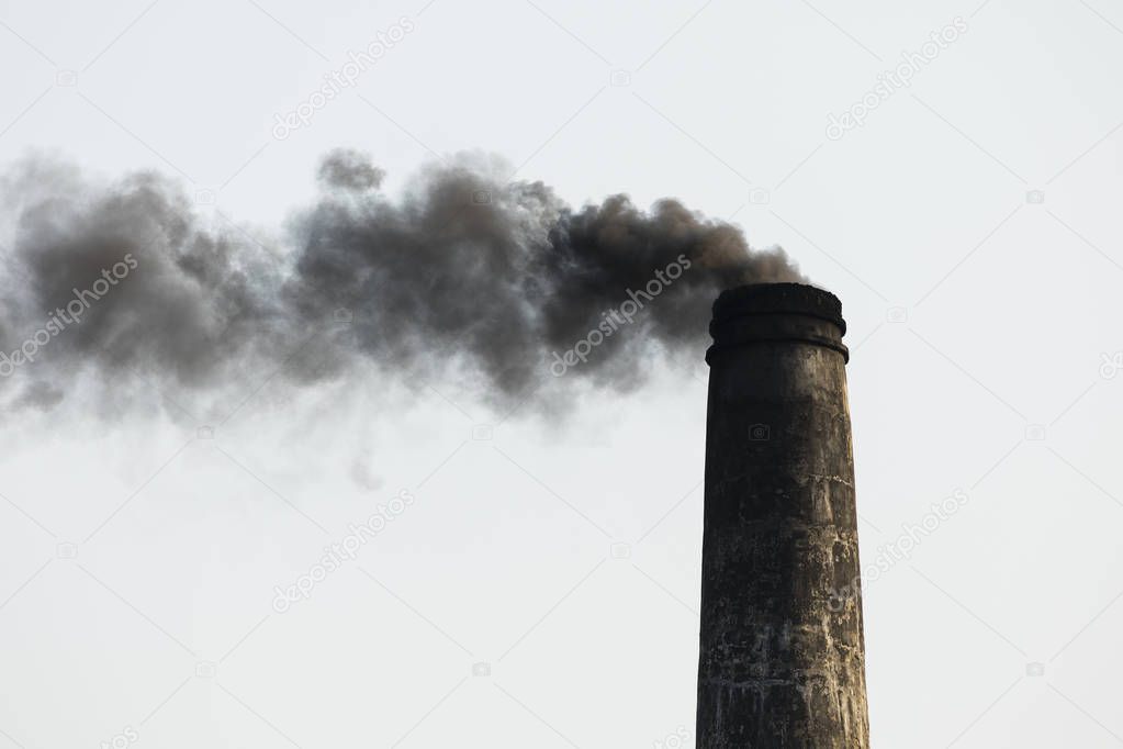 Smoking chimney of a brick factory in Bangladesh
