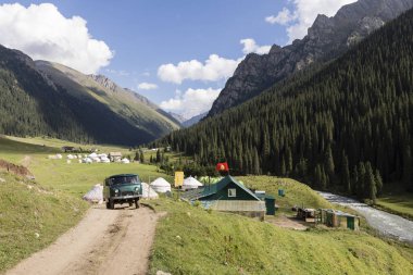 Altyn-Arashan, Kyrgyzstan, August 13 2018: Yurt Camps in the valley of Altyn-Arashan near Karakol in Kyrgyzstan clipart