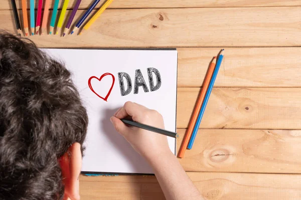 Child Writing Love Dad White Sheet Wooden Table — Stock Photo, Image