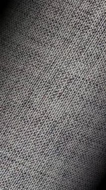 Gri pamuktan pürüzsüz bir dönüş, zarif bir yüzey rahatlaması ve özel lüks dokunsal arka plan formu.