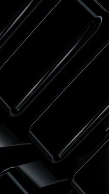 Pürüzsüz siyah figürler, modern bir arka plan tarafından çerçevelenmiş kusursuz metalik parlaklıkta durmaksızın dönerler.