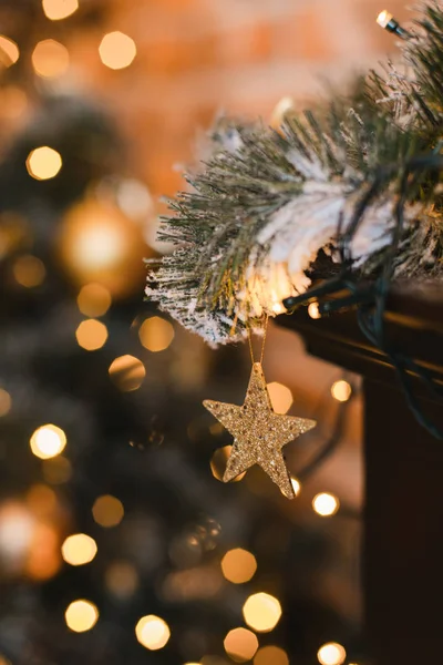 Closeup of Christmas star lights on Christmas tree. Xmas background with christmas decoration.