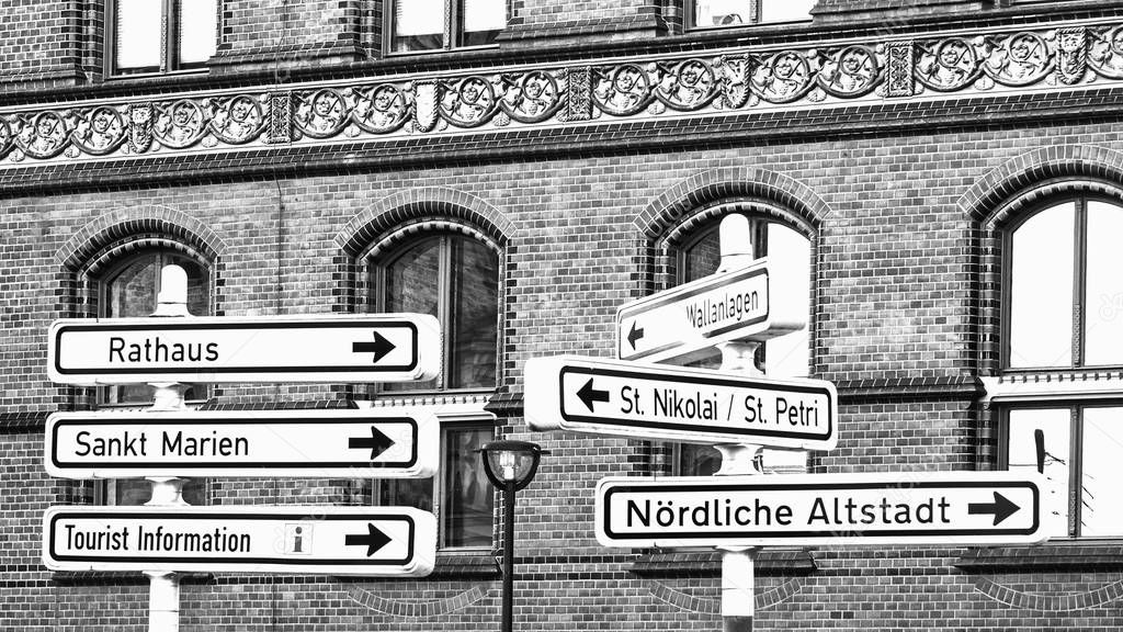 Signs to the points of interest of city Rostock, Germany, monochrome