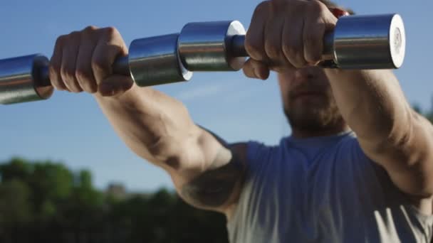 Tattooed brutal sportsman training on field — Stock Footage Tattooed brutal sportsman training on field Video Clip