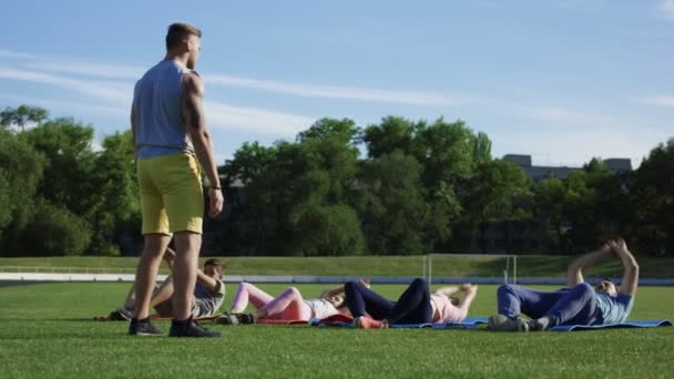 Family working out together on stadium — Stock Video