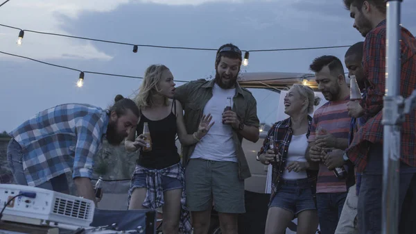 Young people chilling in campsite with van — Stock Photo, Image