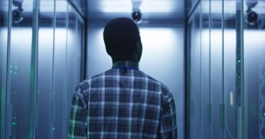 IT specialist walking in server room