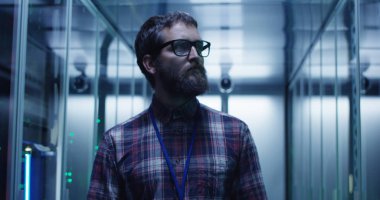 IT specialist walking in server room