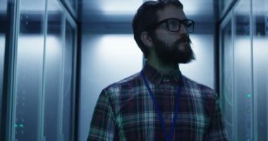 IT specialist walking in server room