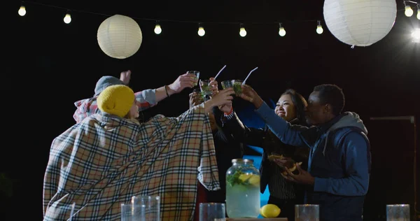 Multi-ethnic friends at a rooftop party — Stock Photo, Image