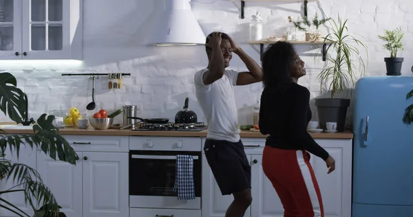 Couple dancing in the kitchen