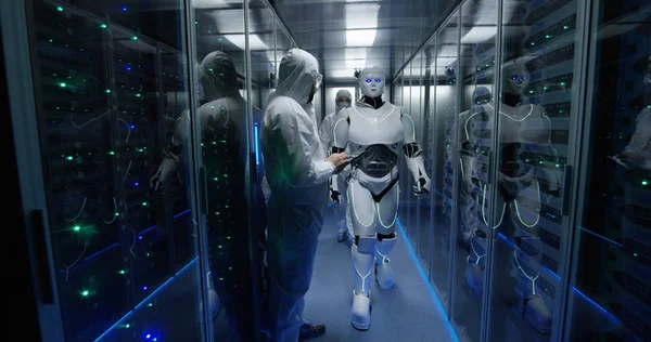 Engineers testing on robot controls inside the laboratory — Stock Photo, Image