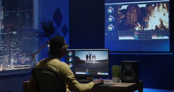 Young man editing video inside a room