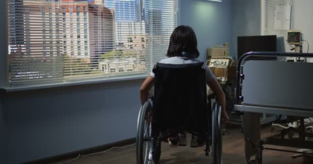 Female patient sitting in wheelchair in hospital — Stock Footage Female patient sitting in wheelchair in hospital Stock Video