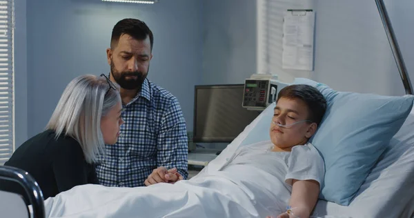 Teenager boy lying in hospital — Stock Photo, Image