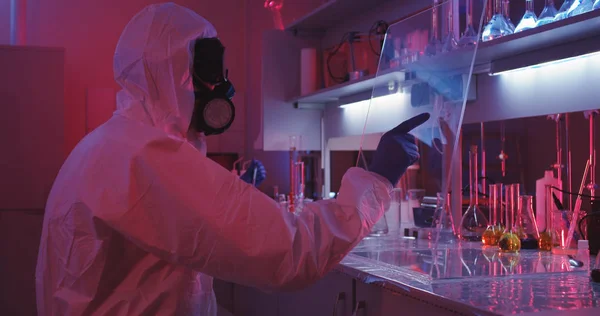 Scientist using transparent display in laboratory — Stock Photo, Image