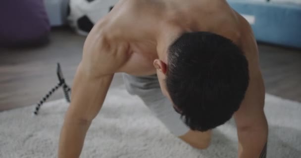 Young man working out at home — Stock Video