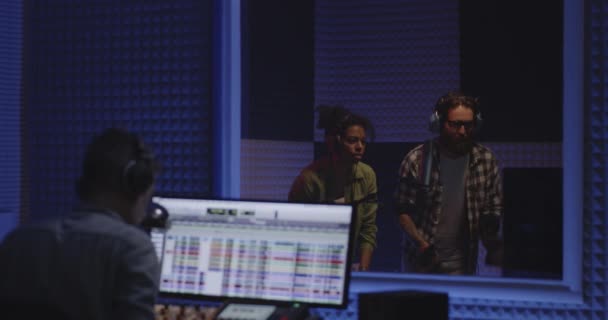 Foley artists and sound engineer working in studio — Stock Video