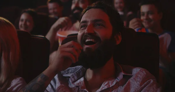 Moviegoers watching comedy movie in cinema — Stock Photo, Image