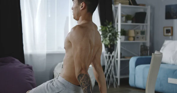 Young man working out at home — Stock Photo, Image