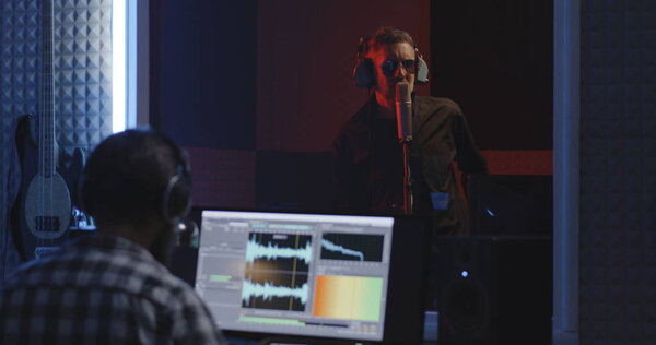 Actor doing voice over in sound studio