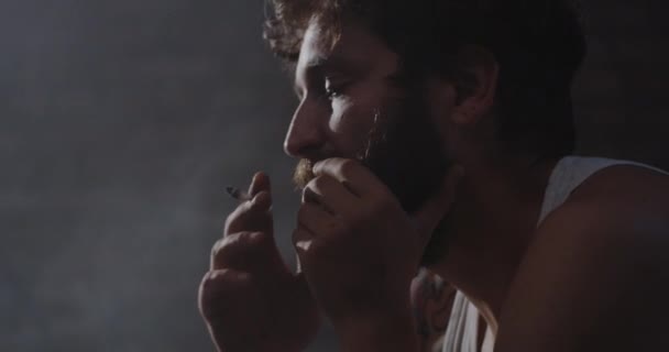 Depressed drug addict smoking — Stock Video
