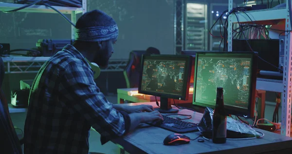 Hackers working at their desks — Stock Photo, Image