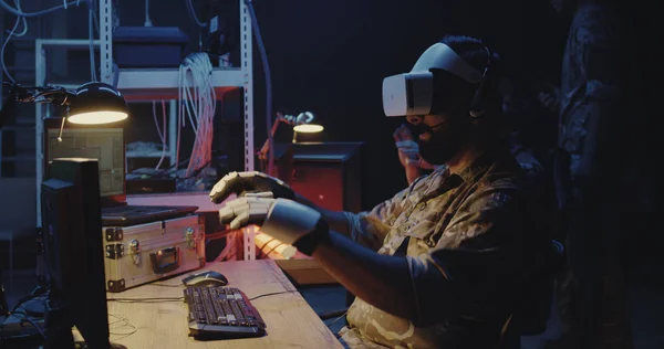 Soldier using VR headset and gloves